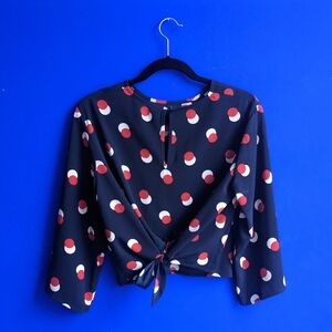 Navy red and white polka dot tie-back blouse